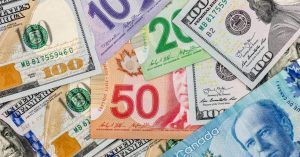 A picture of USD currency and CAD currency