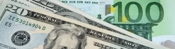 EURUSD_A mix of U.S. bills and various euro banknotes displayed together.