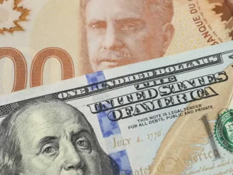 USDCAD- A Close-up of overlapping Canadian and US $100 bills