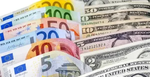 The image shows assorted Euro and U.S. dollar banknotes fanned out-EURUSD