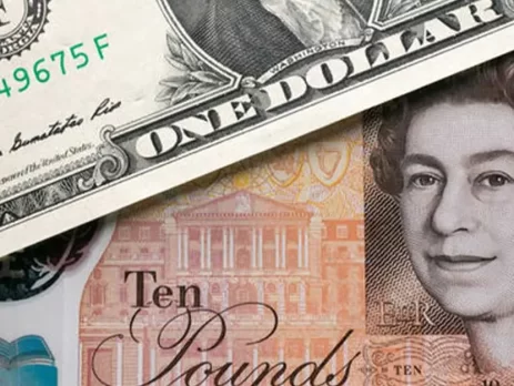 GBPUSD- U.S. dollar bill overlapping British ten-pound note with portraits