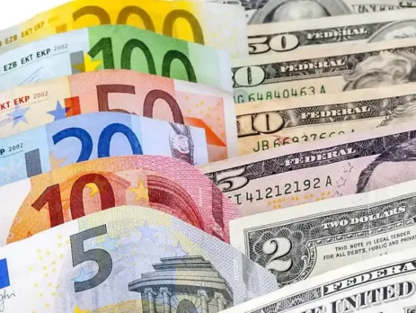 The image shows assorted Euro and U.S. dollar banknotes fanned out-EURUSD