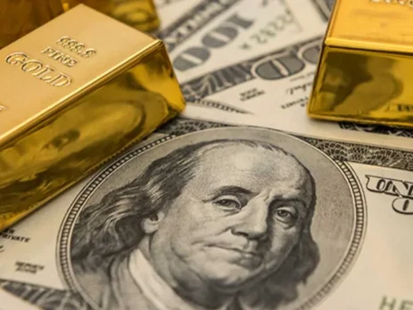 Several gold bars resting on top of 100-dollar bills, prominently featuring Benjamin Franklin's portrait_FXGLORY